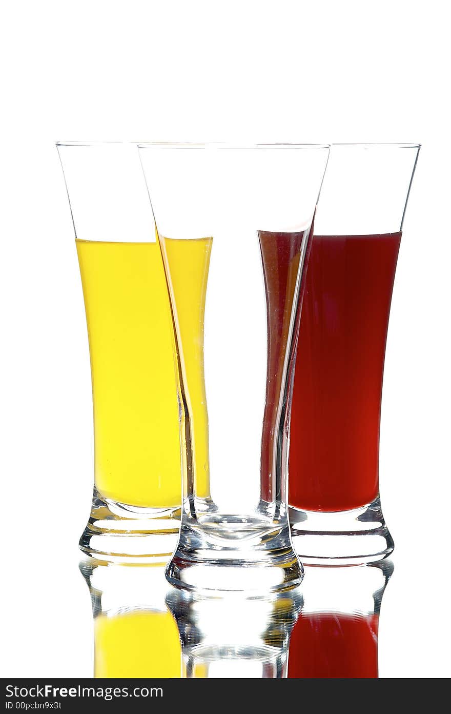 Glasses with juice on the white background