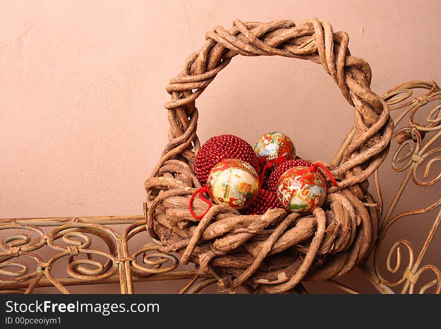 Woven Christmas basket on an old rustic bench