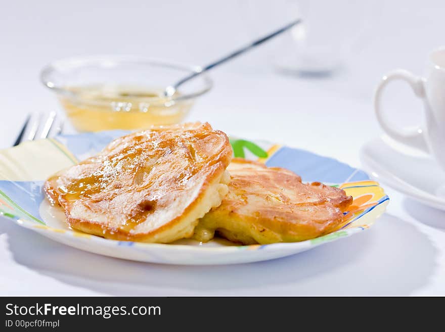 Two pancakes with honey on plate, lunch. Two pancakes with honey on plate, lunch