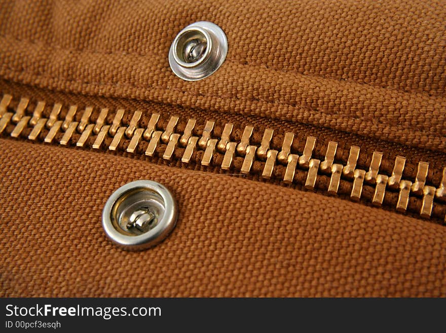 A Large gold zipper macro with snaps