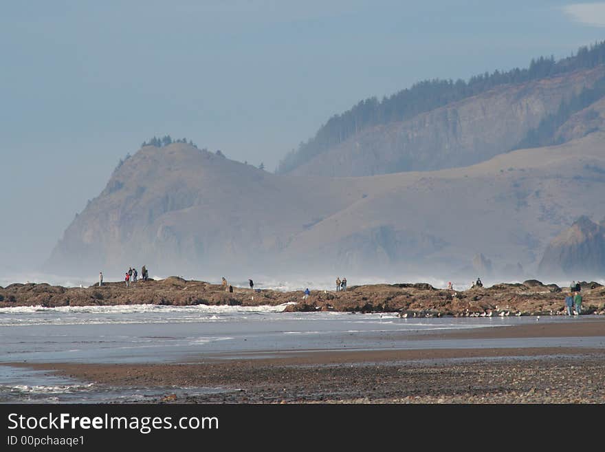 Picture taken at pacific city beach in the daytime with mountins in the background. Picture taken at pacific city beach in the daytime with mountins in the background.