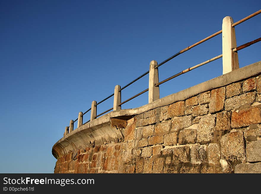 Landscape photo of a coastal sea-wall. Landscape photo of a coastal sea-wall