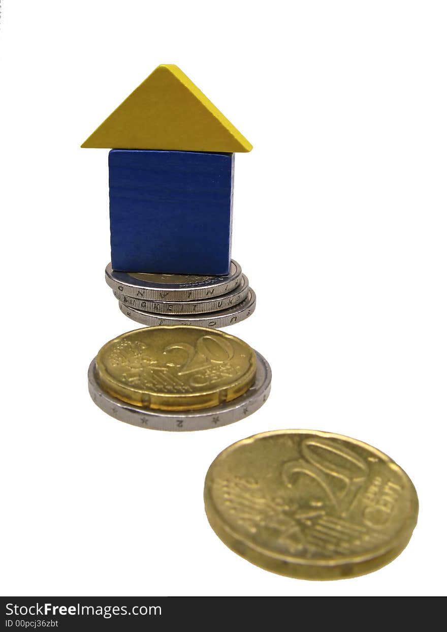 Toy house on coins of euro