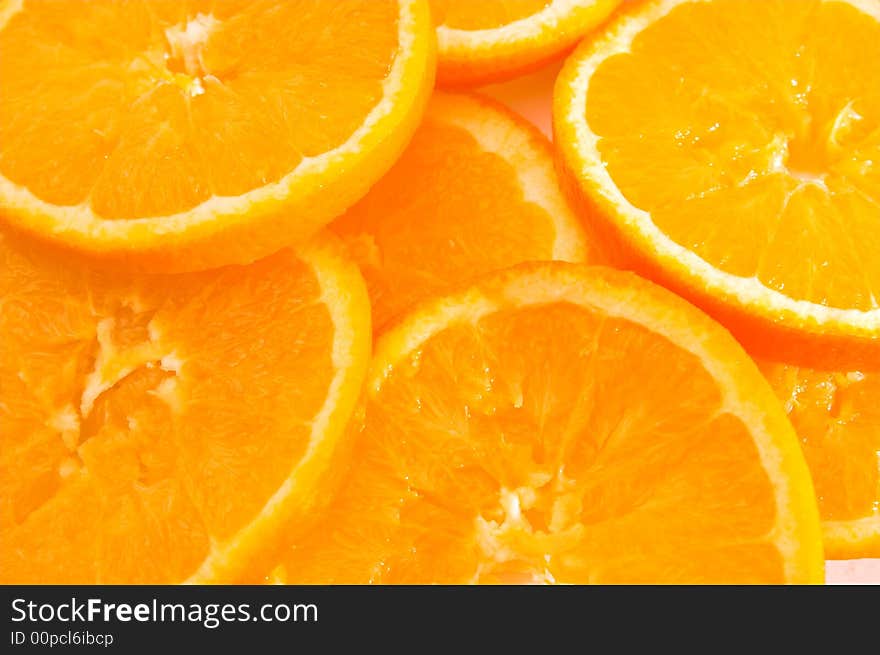 Slices of fresh oranges - background. Slices of fresh oranges - background