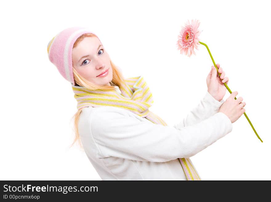 The pretty woman dance with a pink flower in hands