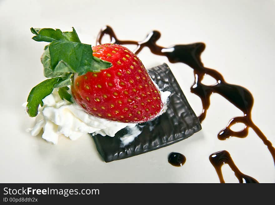 A tasty strawberry dessert isolated on black. A tasty strawberry dessert isolated on black