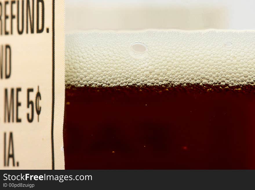 Close-up of a dark beer bottle and label. Close-up of a dark beer bottle and label.