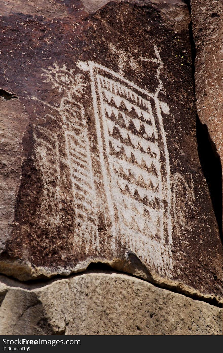 Native American rock art petroglyphs carved into desert varnish covered rock cliffs of Little Petroglyph Canyon of the Coso Range in California. Native American rock art petroglyphs carved into desert varnish covered rock cliffs of Little Petroglyph Canyon of the Coso Range in California