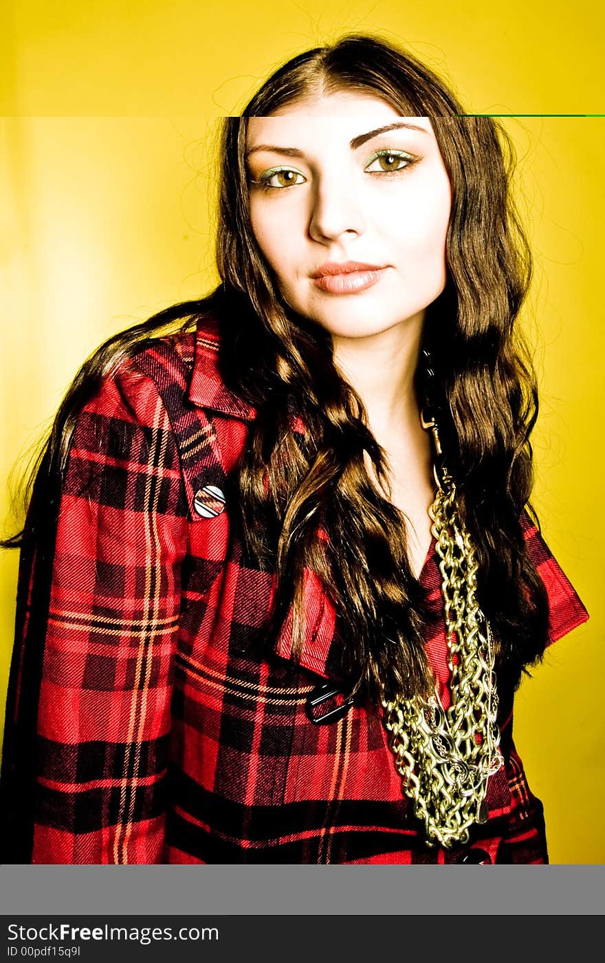 A young model posing in the studio, with styled outfits.