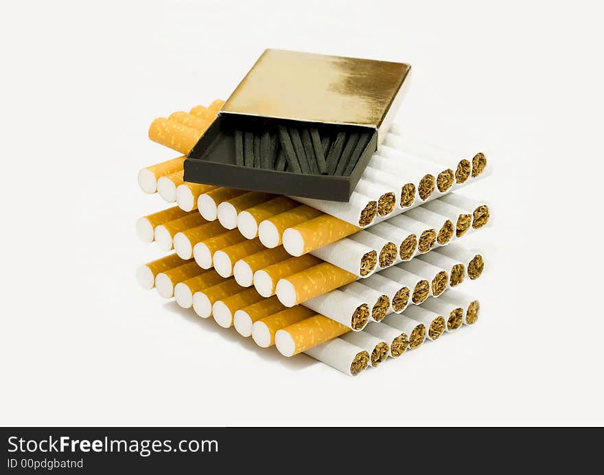 A box of matches on top of cigarettes