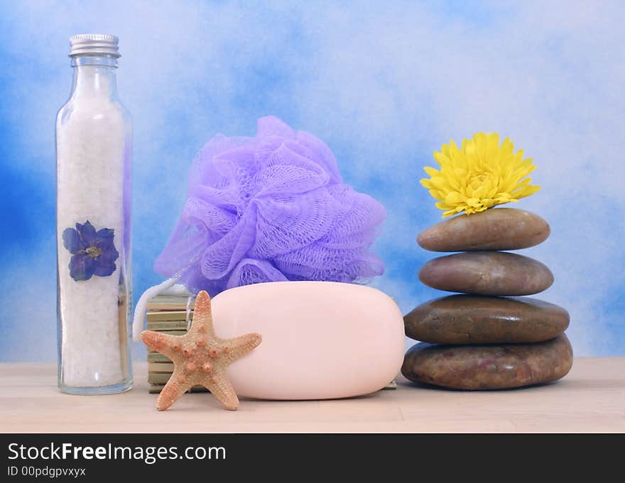 Soap and Massage Stones on Blue Textured Background. Soap and Massage Stones on Blue Textured Background