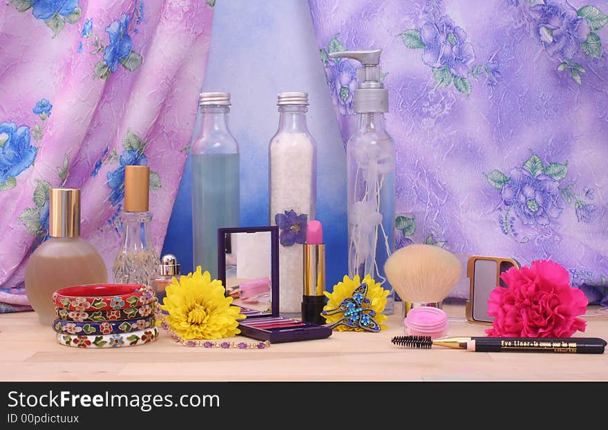 Cosmetics and Jewelry With Flowers and Perfume