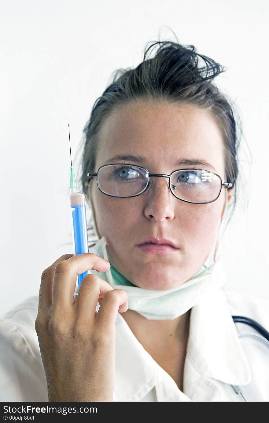 Nurse with glasses holding an injection. Nurse with glasses holding an injection