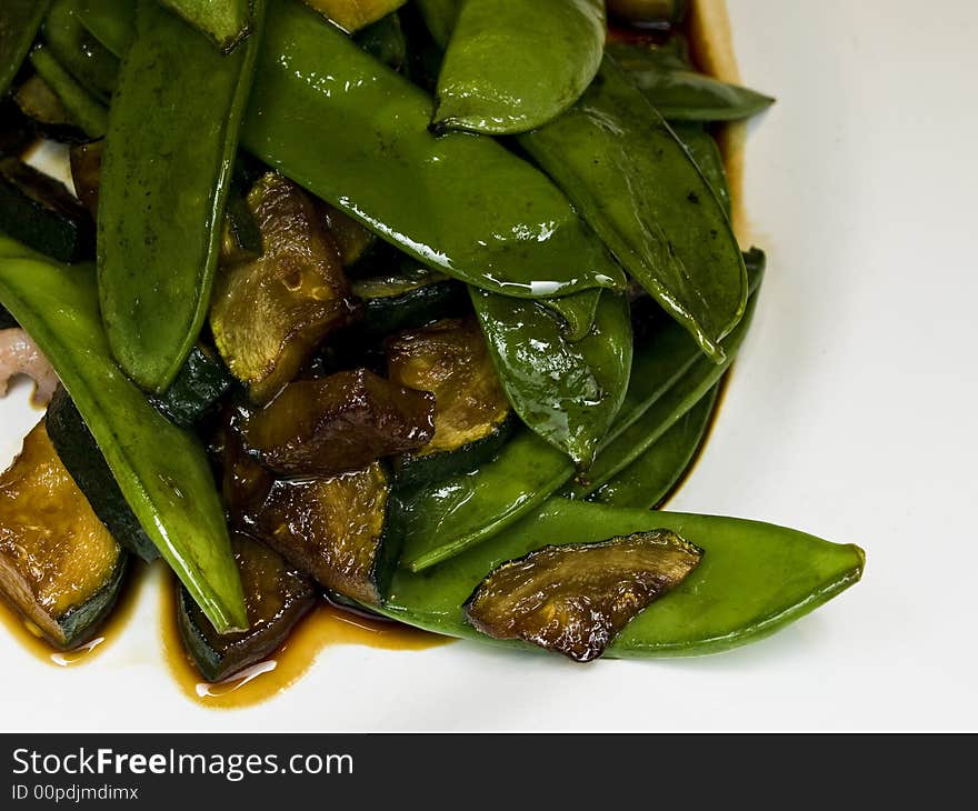 Macro of peas and zucchini in a salad with soy sauce