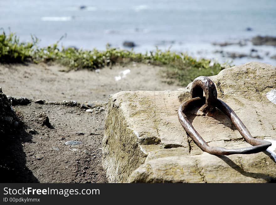 Old mooring slab at the Lizard Peninsular, Cornwall, England, focusing on the mooring looking out to sea...