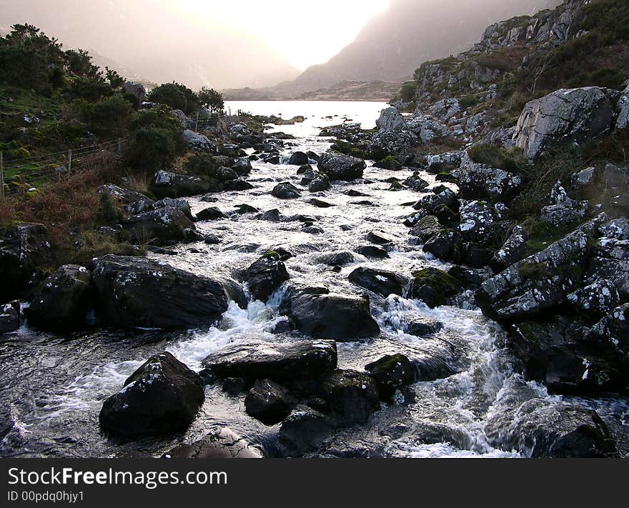 Taken in Kerry, Ireland, looking up a stream surrounded by mountains in winter, great contrast between the rocks and water. Taken in Kerry, Ireland, looking up a stream surrounded by mountains in winter, great contrast between the rocks and water