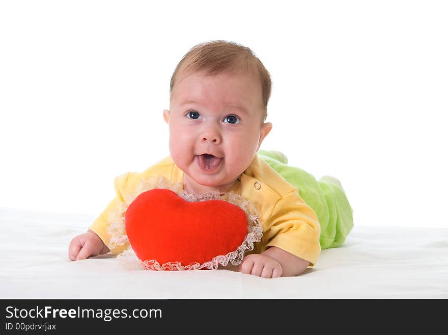 Baby with a soft toy in the form of heart isolated