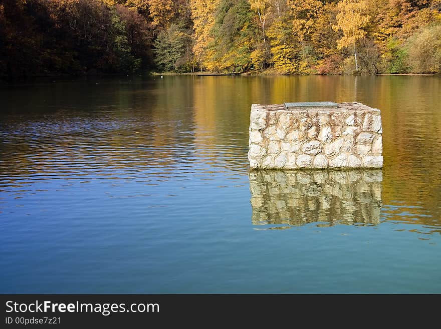 Rocky structure on lake surface