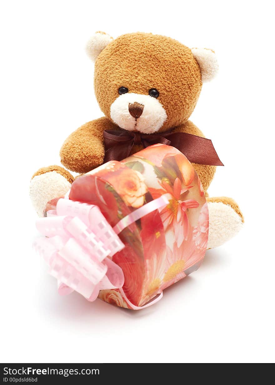 Classic brown Teddy Bear with heart-shaped present