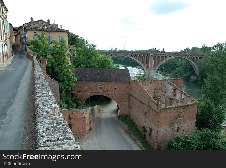 The city of Rabastens, located in the South West of France in the Tarn  Department (81). The photo, taken from the Old Walls street shows the 1924 bridge crossing the Tarn River and the Promenade de Constance on the shores. The city of Rabastens, located in the South West of France in the Tarn  Department (81). The photo, taken from the Old Walls street shows the 1924 bridge crossing the Tarn River and the Promenade de Constance on the shores