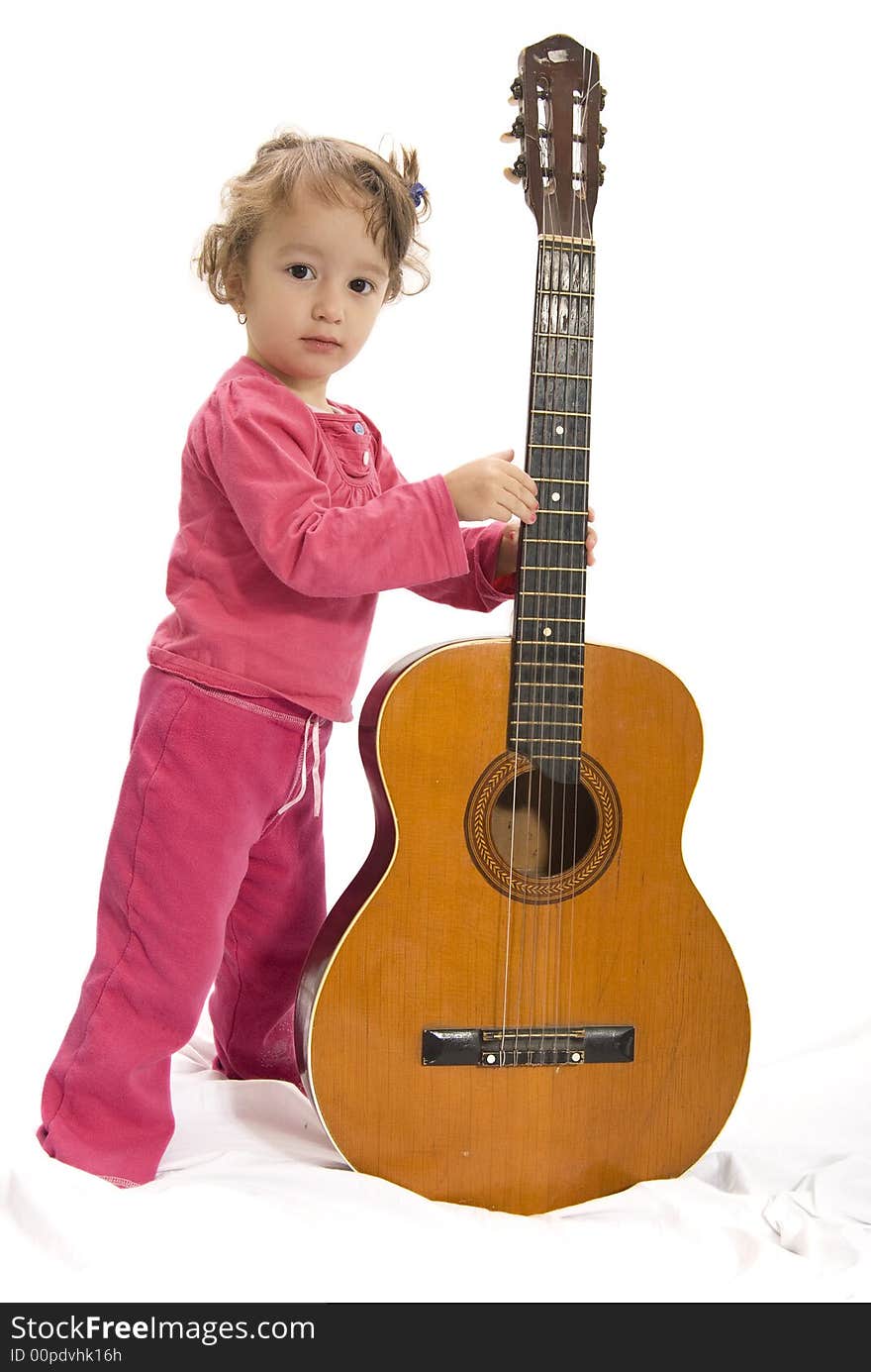 Young girl holding a guitar. Young girl holding a guitar