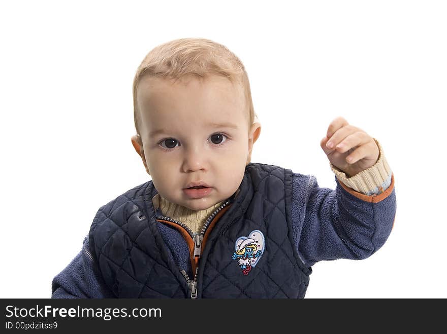 Cute baby boy posing in front of camera. Cute baby boy posing in front of camera