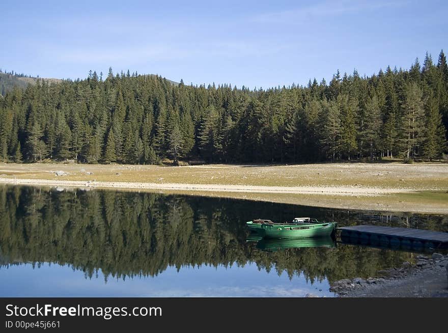 Two boats on the mole of the lake