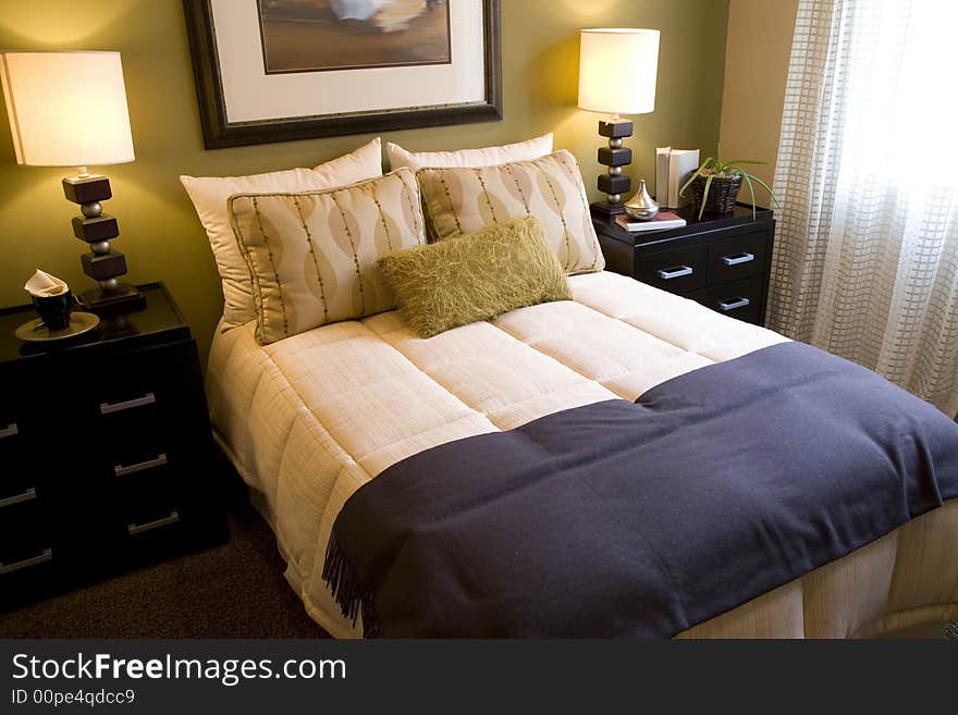 Comfortable bedroom in a luxury home with stylish decor. Comfortable bedroom in a luxury home with stylish decor.