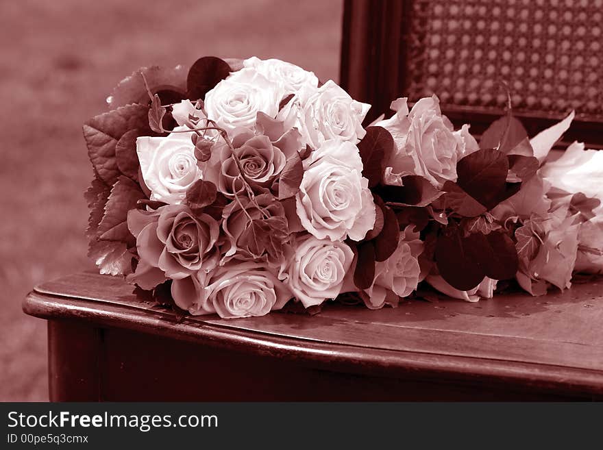 White Wedding bouquet on wooden chair