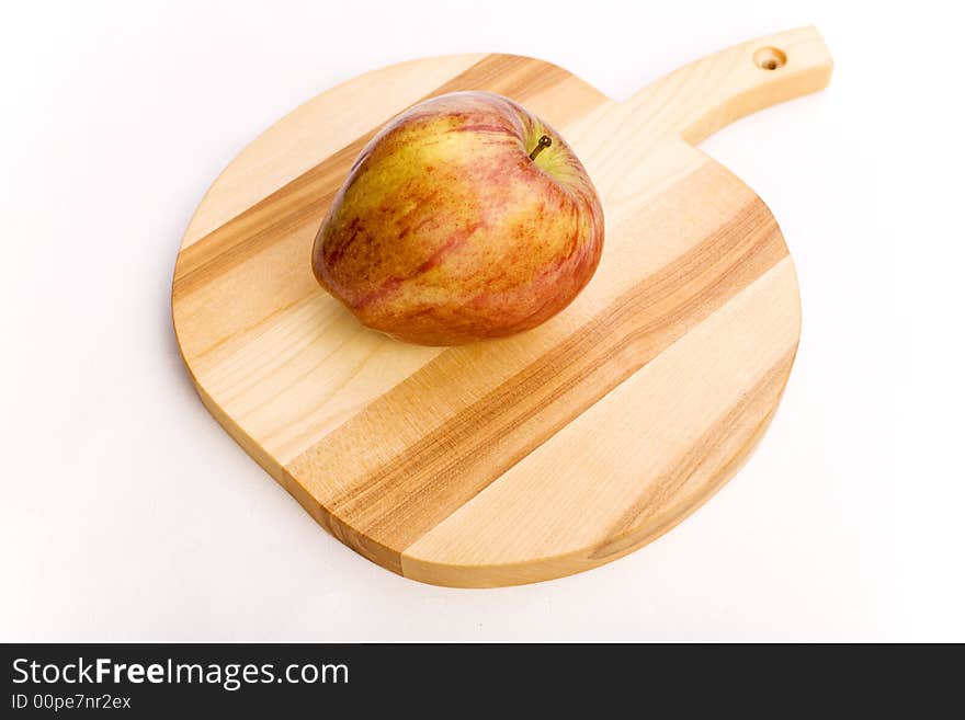 Red apple over a wooden apple shaped potstand