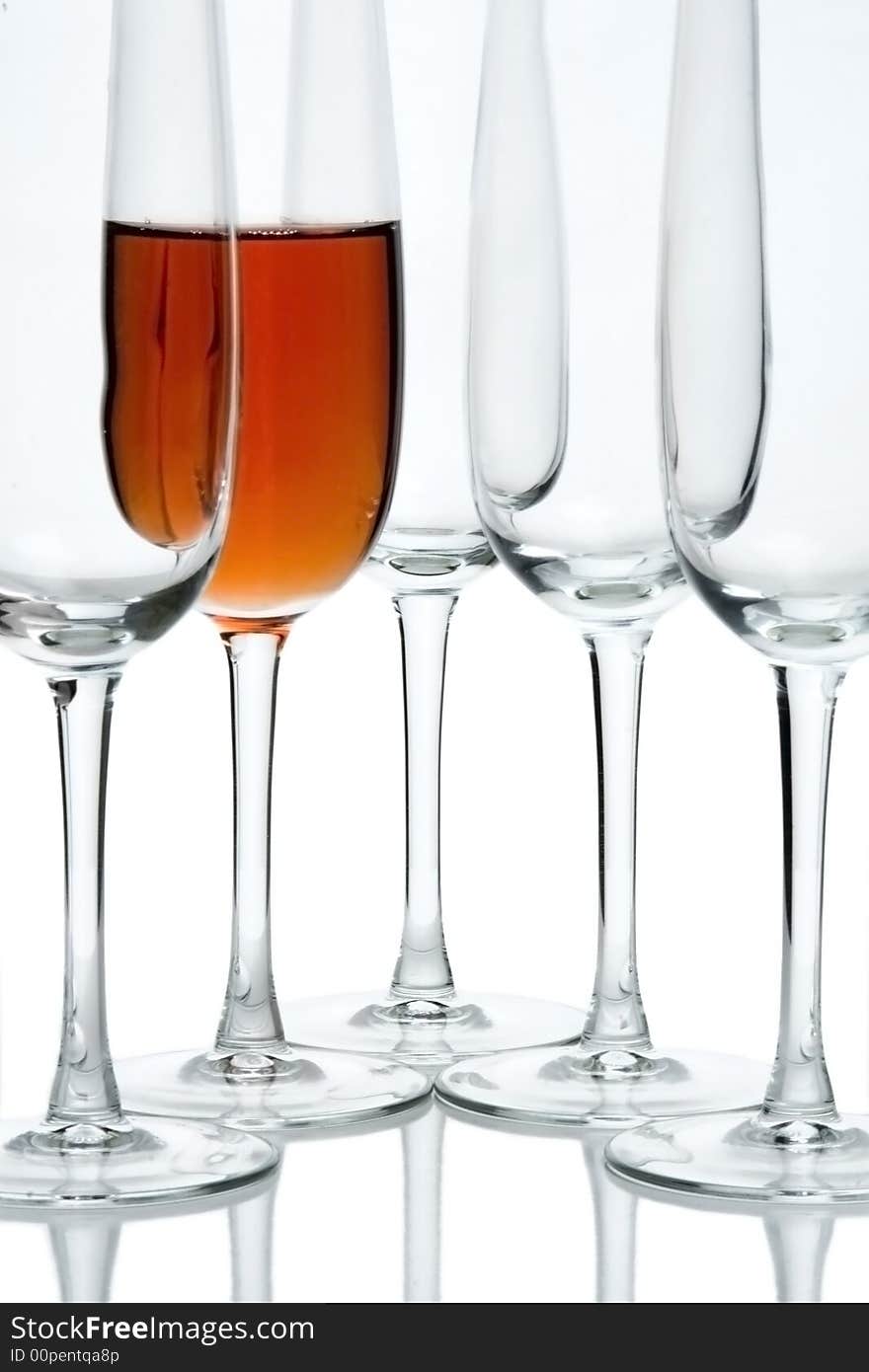 Glasses in studio on a white background, placed in a row. Glasses in studio on a white background, placed in a row