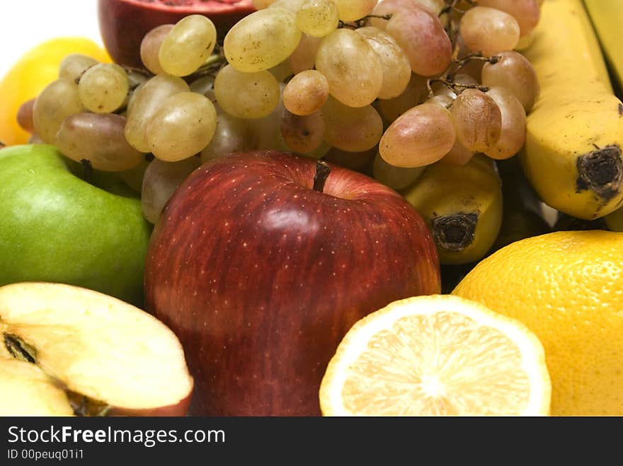 Fruit background. Apple, grape, banane, pomegranate, lemon.