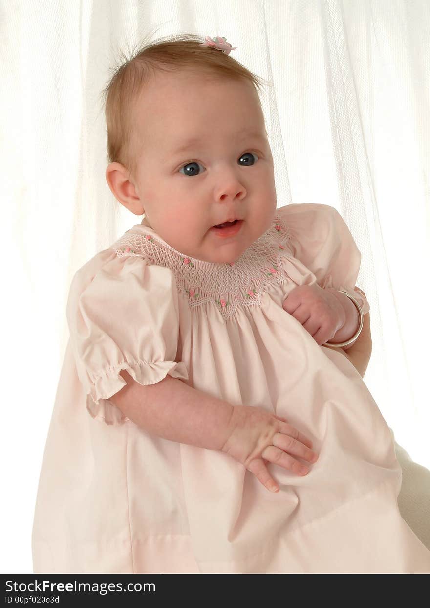 Very young baby girl with beautiful bright eyes