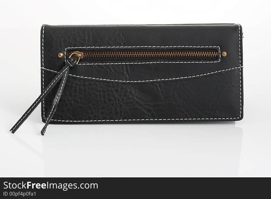 A black leather purse over a white background. A black leather purse over a white background