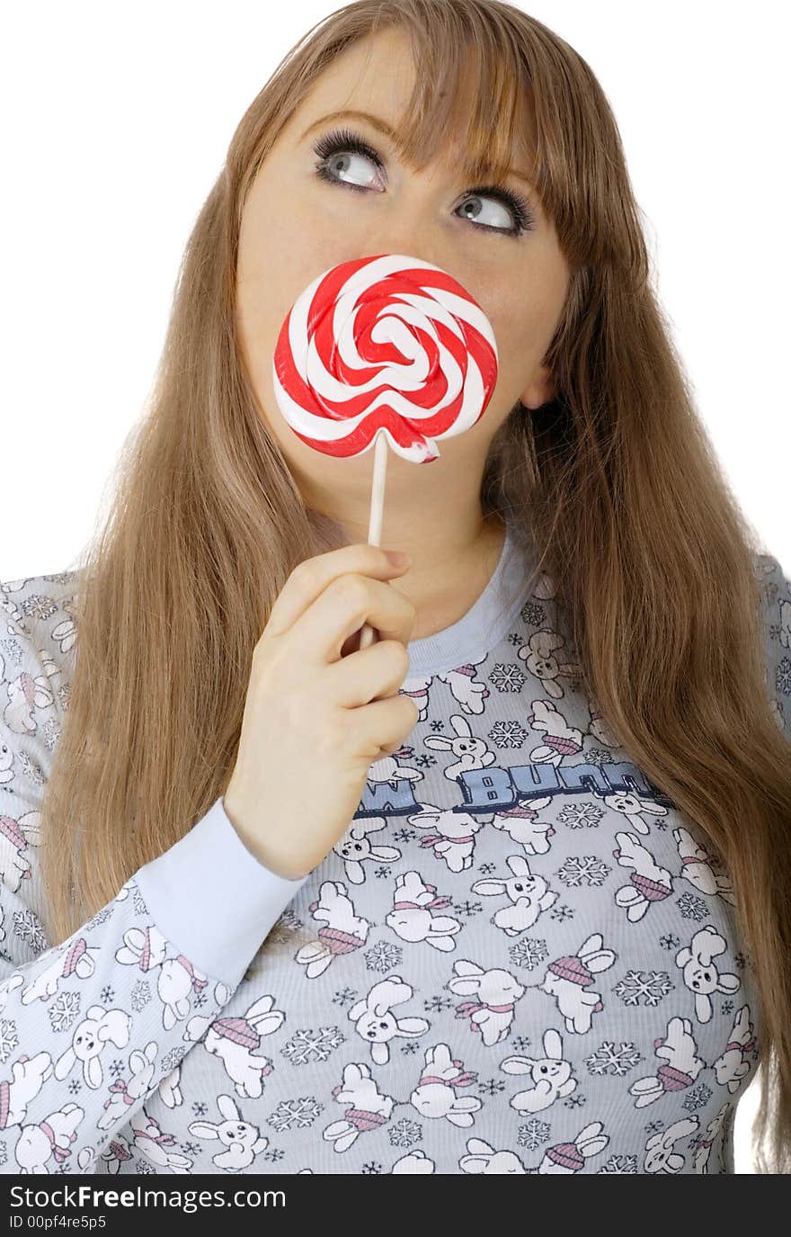 Bunny girl wearing bunny shirst covering mouth with lollipop and looking up. Bunny girl wearing bunny shirst covering mouth with lollipop and looking up