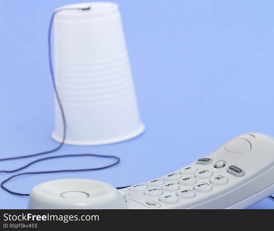 Photo of a telephone over a blue background. Photo of a telephone over a blue background