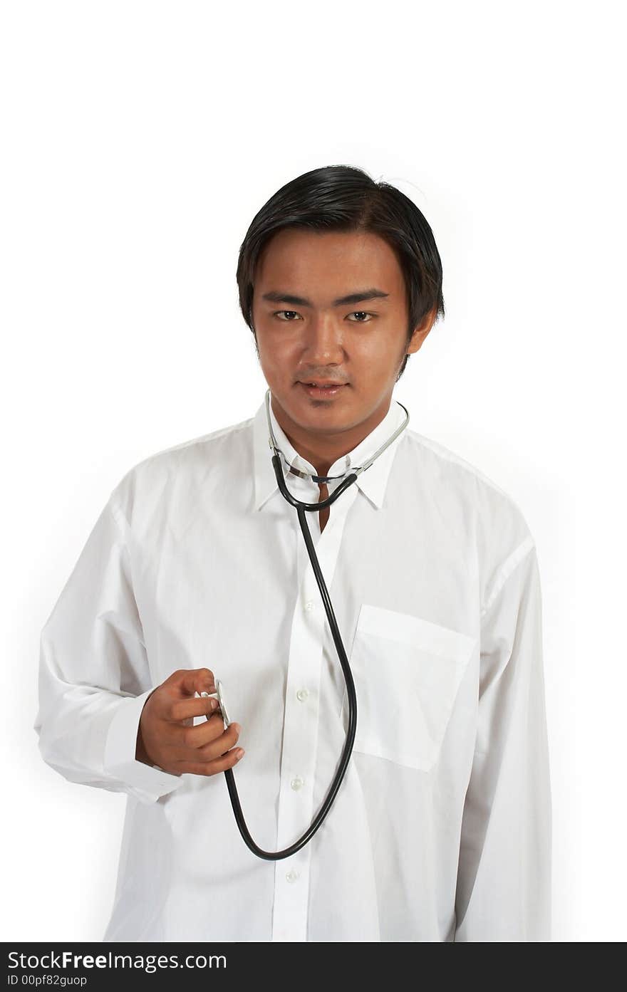 A doctor holding a stethoscope over a white background. A doctor holding a stethoscope over a white background