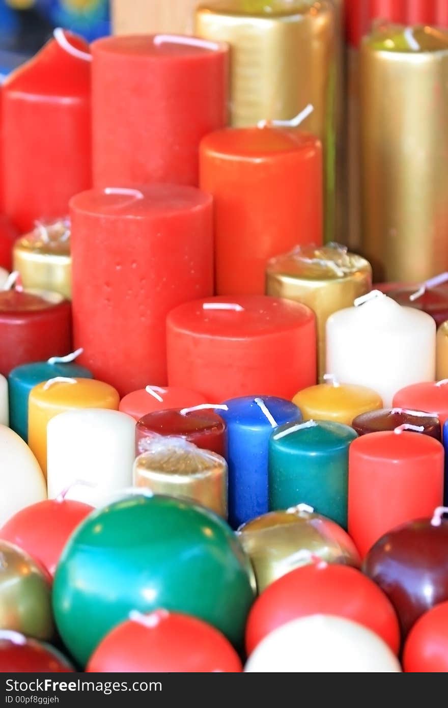 Candles of different form, color and size on a christmas market