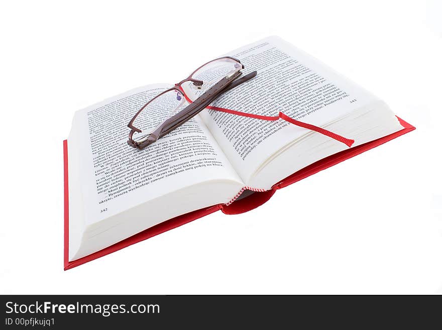 Open red book with glasses isolated on a white background. Open red book with glasses isolated on a white background