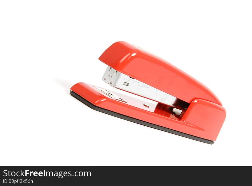 A red stapler isolated on white. A red stapler isolated on white.