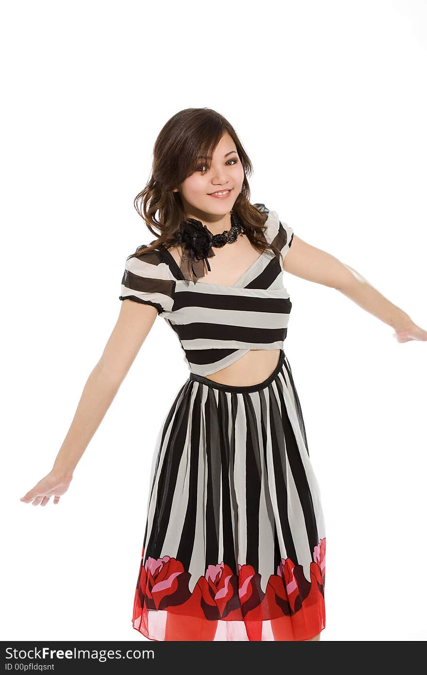 Happy girl in black and white stripes dress stretching hands. Happy girl in black and white stripes dress stretching hands