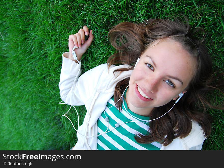 Young nice girl laying on the grass. Young nice girl laying on the grass