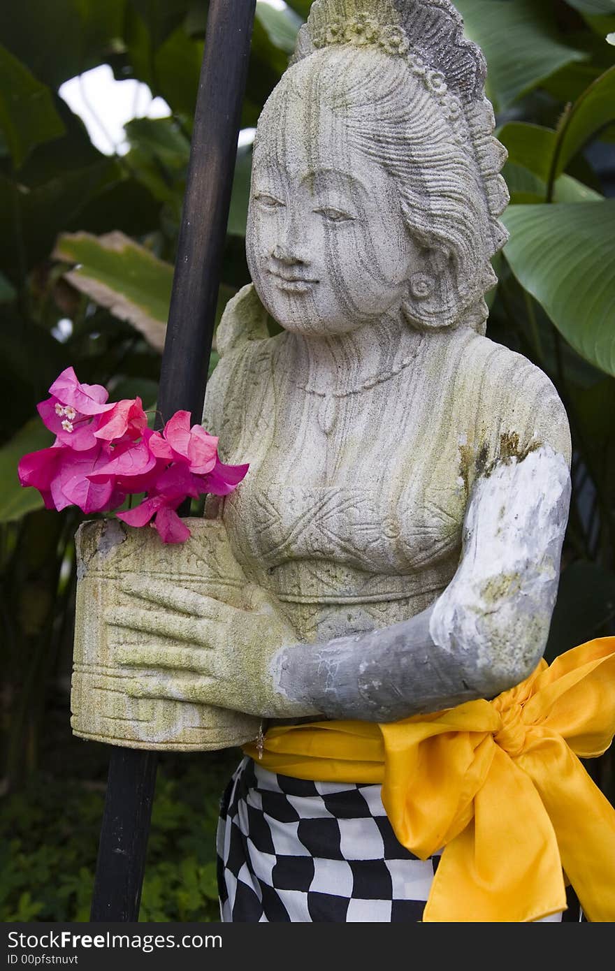 A striated stone statue of a thai lady. A striated stone statue of a thai lady