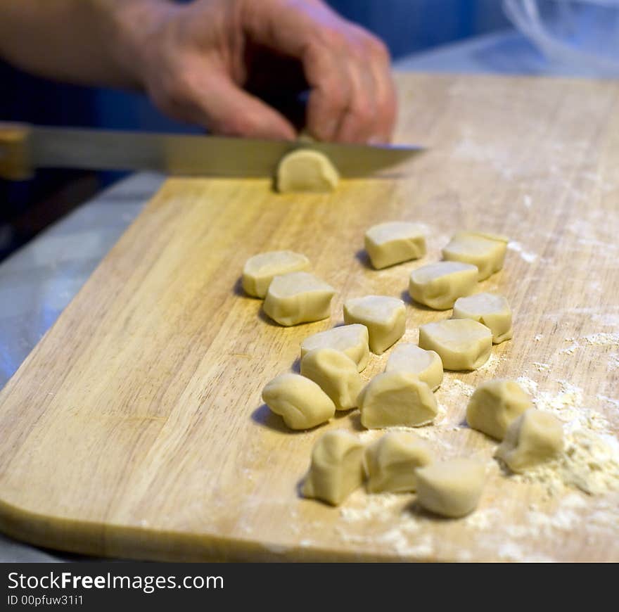 The cook is prepared with a dough for ravioli. The cook is prepared with a dough for ravioli