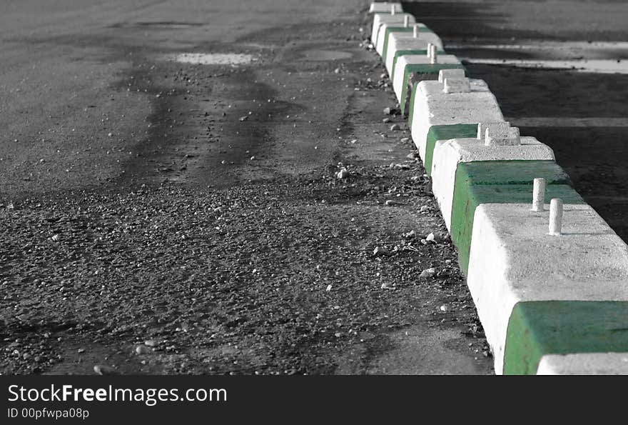 Heavy concrete traffic barricades on gravel car-park. Heavy concrete traffic barricades on gravel car-park