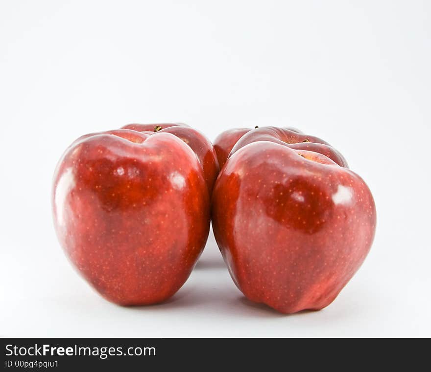 Red apples on white background