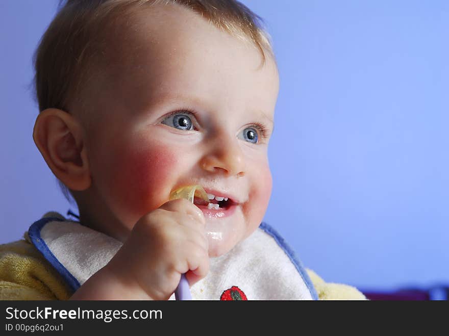 An eating little happy boy. An eating little happy boy