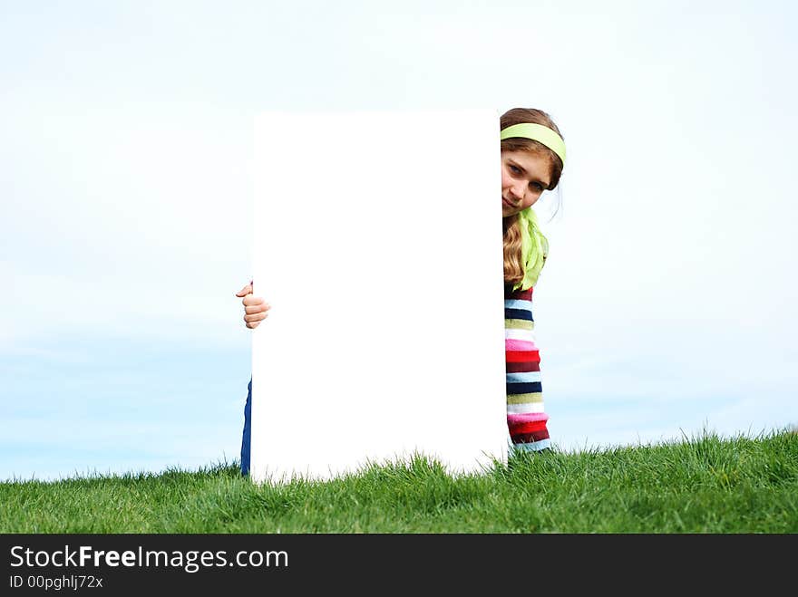 Young girl holding blank sign