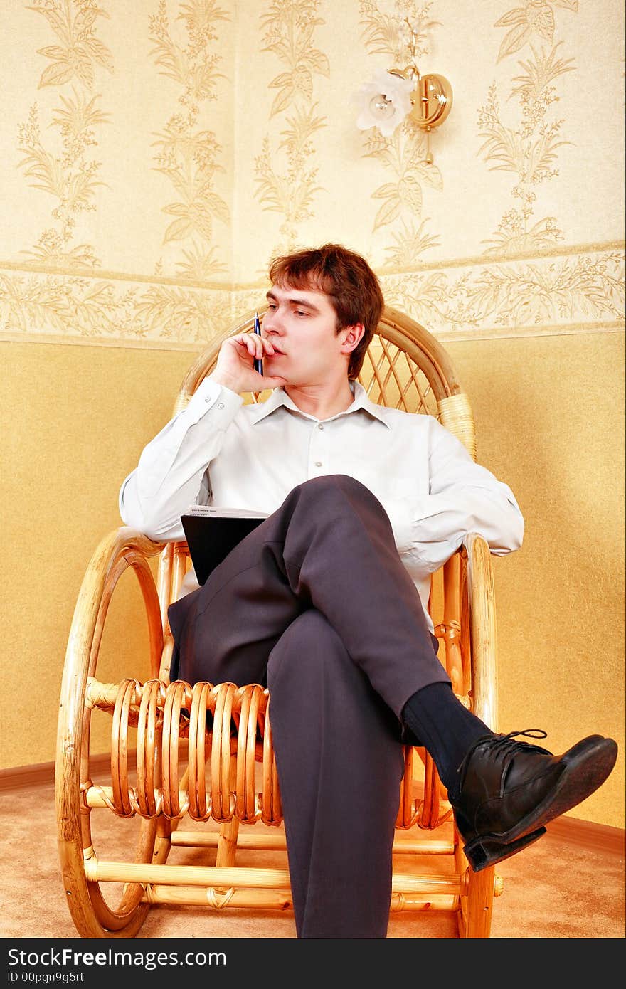 Young stylish man home with laptop