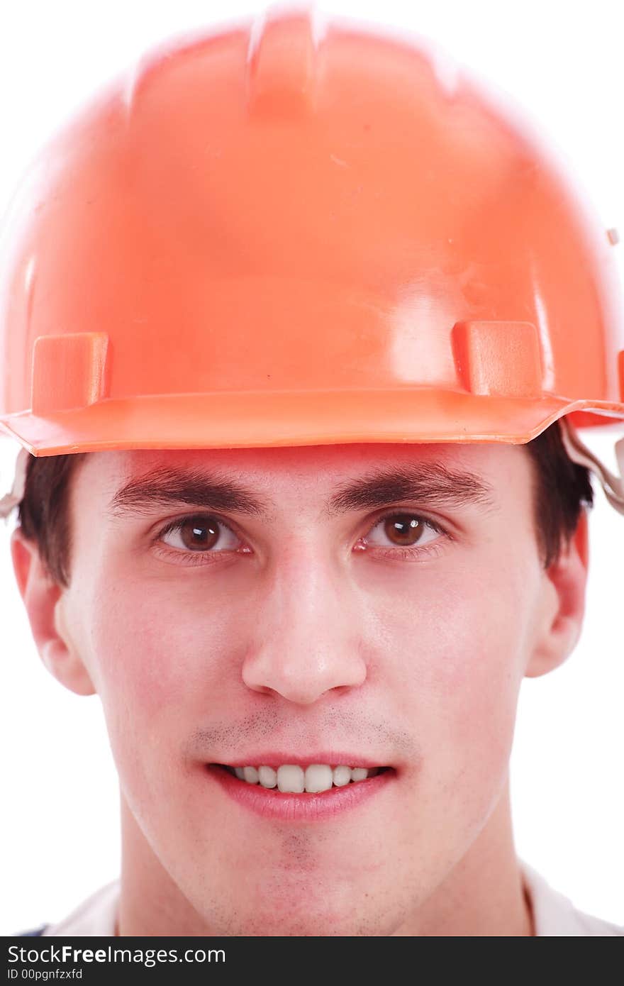 Muscular young man in a builder uniform with tools. Muscular young man in a builder uniform with tools.